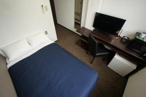 Voodi või voodid majutusasutuse HOTEL LiVEMAX BUDGET Gunma Numata toas