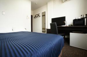 Voodi või voodid majutusasutuse HOTEL LiVEMAX BUDGET Gunma Numata toas