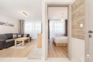 Posteľ alebo postele v izbe v ubytovaní Jantar Apartamenty Bliżej Morza