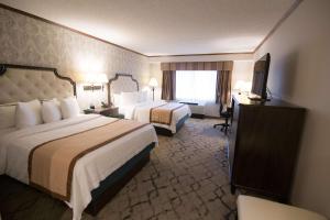 Postel nebo postele na pokoji v ubytování Best Western Plus Fairfield Executive Inn