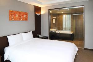 Postel nebo postele na pokoji v ubytování Mstay Hotel
