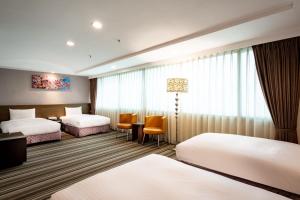 Postel nebo postele na pokoji v ubytování Yoyo Hotel
