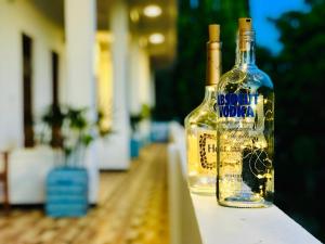 a bottle of alcohol sitting on a table at Oasis Bay in Arugam Bay