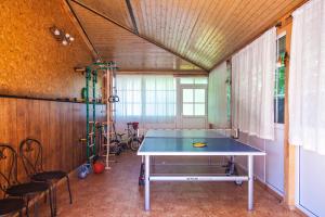 a room with a ping pong table in it at Arabela in Rīga