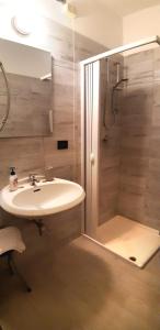 a bathroom with a sink and a shower at Hotel Provenza in Ventimiglia