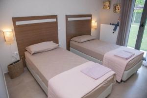 Krevet ili kreveti u jedinici u okviru objekta Luxury Villas 1