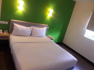 Krevet ili kreveti u jedinici u objektu Amaris Hotel Ambon