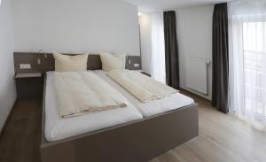 Postel nebo postele na pokoji v ubytování Apartment Hotel 37