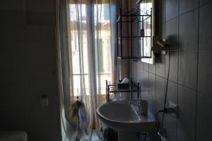 a bathroom with a sink and a window at La Contrada in Sarnico +33 photos