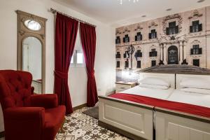 Giường trong phòng chung tại Jean de Valette Boutique Living