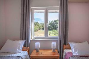 Postel nebo postele na pokoji v ubytování Joleni Cottage in Keramies + 21 fotografií