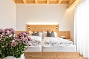 Postel nebo postele na pokoji v ubytování Hotel Moritz