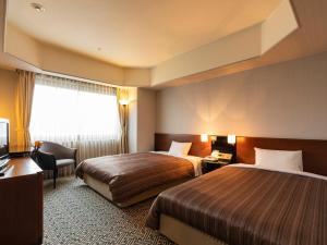 Krevet ili kreveti u jedinici u okviru objekta Ark Hotel Kumamotojo Mae -ROUTE INN HOTELS-