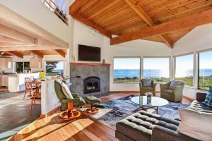 a living room with a couch and a fireplace at Casa Pelo Mar in Sea Ranch