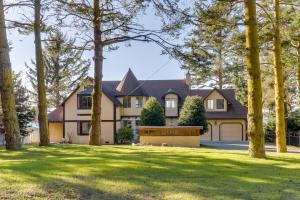 a house with trees in front of it at West Beach Waterview in Oak Harbor