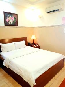 Postel nebo postele na pokoji v ubytování Thanh An Hotel