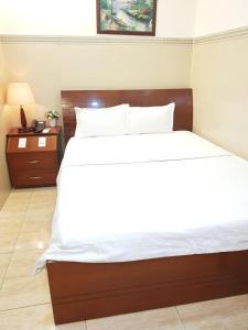 Postel nebo postele na pokoji v ubytování Thanh An Hotel