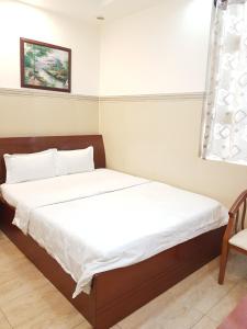 Postel nebo postele na pokoji v ubytování Thanh An Hotel