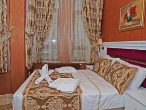Postel nebo postele na pokoji v ubytování Glamour Classic Hotel Istanbul Sirkeci