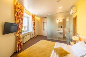 Postel nebo postele na pokoji v ubytování Mini-hotel People