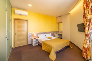 Postel nebo postele na pokoji v ubytování Mini-hotel People
