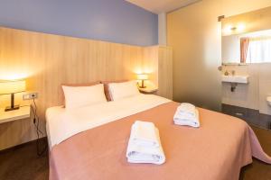 Postel nebo postele na pokoji v ubytování Mini-hotel People