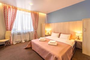 Postel nebo postele na pokoji v ubytování Mini-hotel People