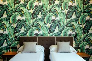 Posteľ alebo postele v izbe v ubytovaní Málaga Premium Hotel