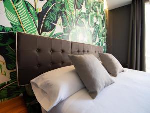 Posteľ alebo postele v izbe v ubytovaní Málaga Premium Hotel