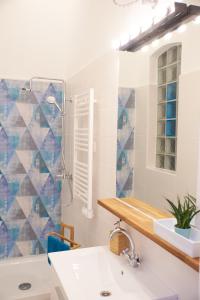 a bathroom with a sink and a mirror at Self check-in Cozy Stylish Flat by Vaci Street in Budapest