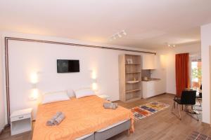 מיטה או מיטות בחדר ב-Apartments Cocaletto
