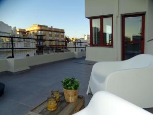 a balcony with a view of a city skyline at ÁTICO EN EL CENTRO DE VALENCIA Pta 12 VT-45939-T in Valencia