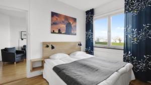 Säng eller sängar i ett rum på Strand Hotell Borgholm