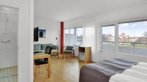 TV a/nebo společenská místnost v ubytování Strand Hotell Borgholm