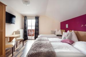 Łóżko lub łóżka w pokoju w obiekcie Chalet Jagdhof