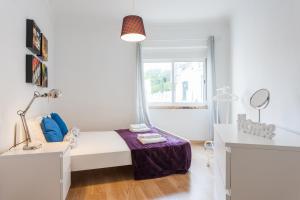 Katil atau katil-katil dalam bilik di FLH Cosy Apartment in Lapa