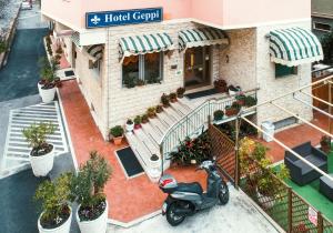 an aerial view of a scooter parked outside of a building at Hotel Geppi in Pietra Ligure
