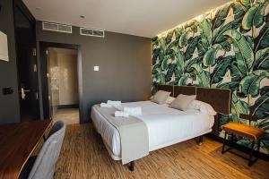 Posteľ alebo postele v izbe v ubytovaní Málaga Premium Hotel