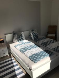 a bedroom with two beds with pillows on them at Appartement Moervig in Flensburg