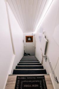 
a hallway with stairs leading up to a staircase at Beautiful holiday home (studio) in Rovaniemi in Rovaniemi
