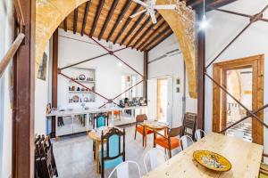 an open kitchen and dining room with wooden tables and chairs at NICOSIA EAGLE EYE in Lefkosa Turk
