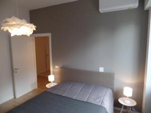 Postel nebo postele na pokoji v ubytování Residenza Vittorio Emanuele