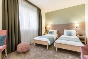 Ένα ή περισσότερα κρεβάτια σε δωμάτιο στο Hotel Mondo