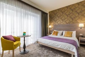 Ένα ή περισσότερα κρεβάτια σε δωμάτιο στο Hotel Mondo