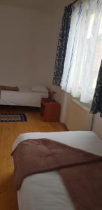 Postel nebo postele na pokoji v ubytování Coroian House