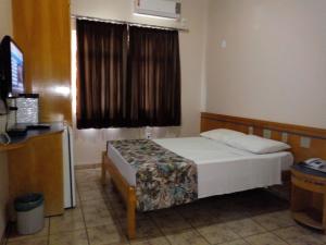 Posteľ alebo postele v izbe v ubytovaní Hotel Nacional Service