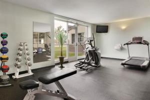 a fitness room with a gym with a treadmill at Country Inn & Suites by Radisson, Fergus Falls, MN in Fergus Falls