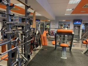 a gym with a bunch of equipment in it at Hotel Patriot in Vranov nad Topľou