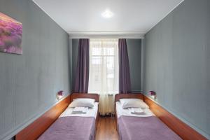 Säng eller sängar i ett rum på RA Hotel at Tambovskaya 11