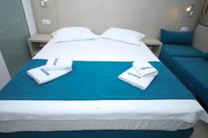 Postel nebo postele na pokoji v ubytování Hotel Delfin